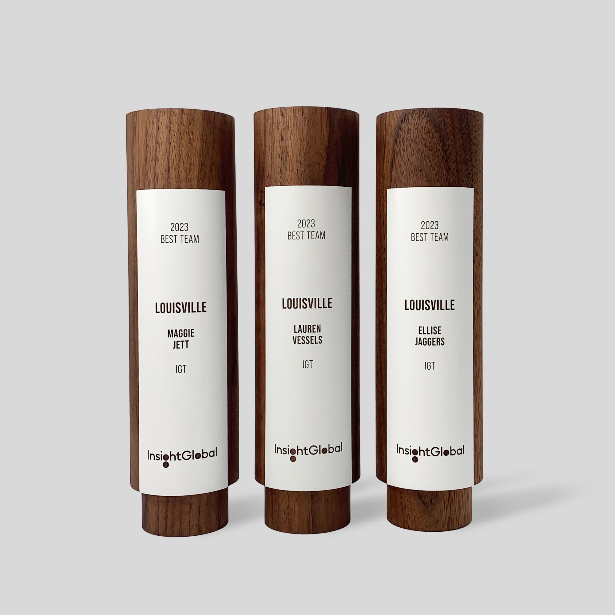 Geometria Award Circulus: unique, modern, wooden, cylindrical award trophies with white engraved color fields , showcasing minimalist design inspired by unity, crafted from walnut or maple. Architect-designed and artisan-crafted in USA.