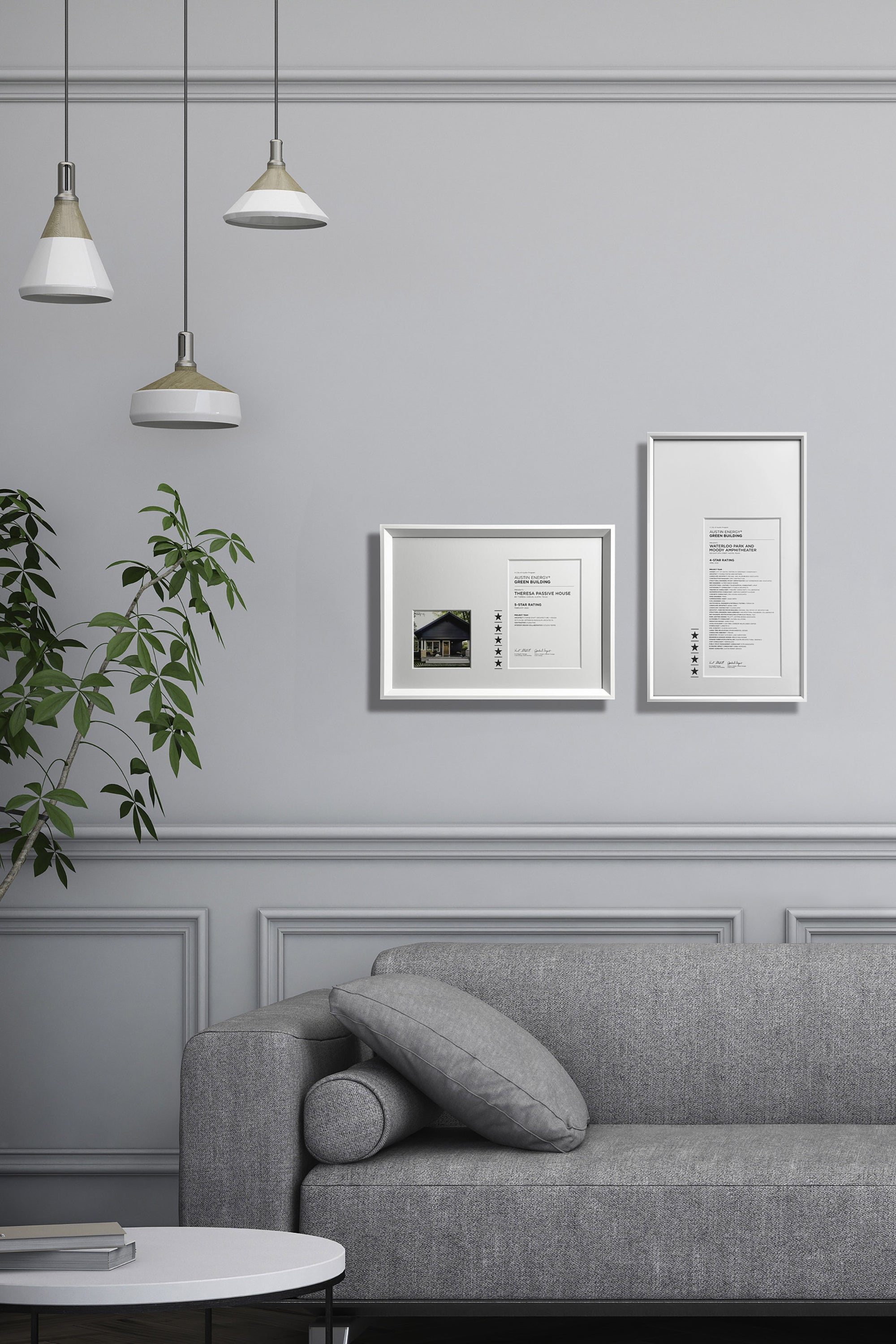 White frames displaying custom award certificates on a wall, with four and five star recognition ratings and engraving.