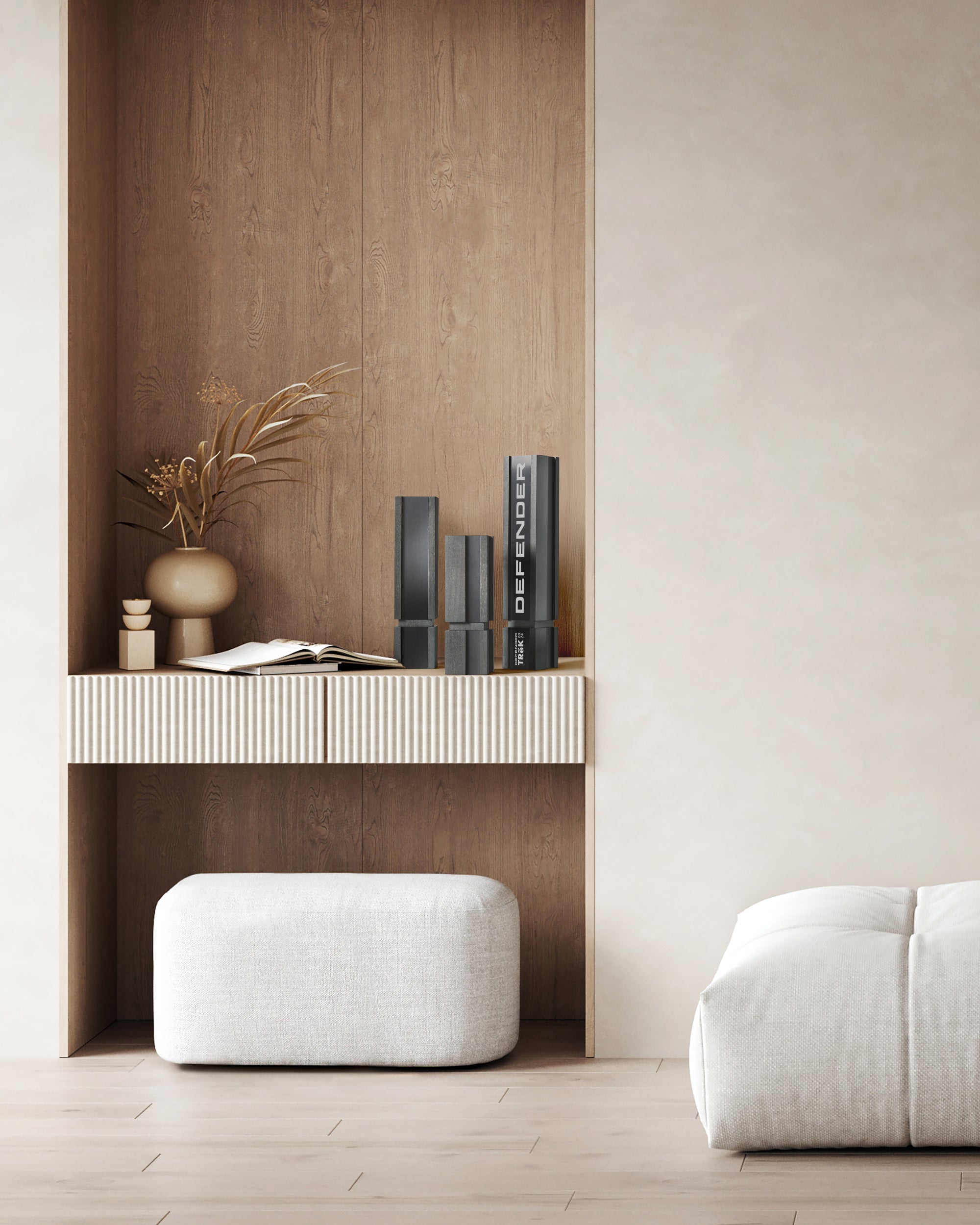 A group of three unique wooden executive recognition awards stand on a ledge shelf. One award is engraved and personalized next to a vase with florals and ottoman below. 