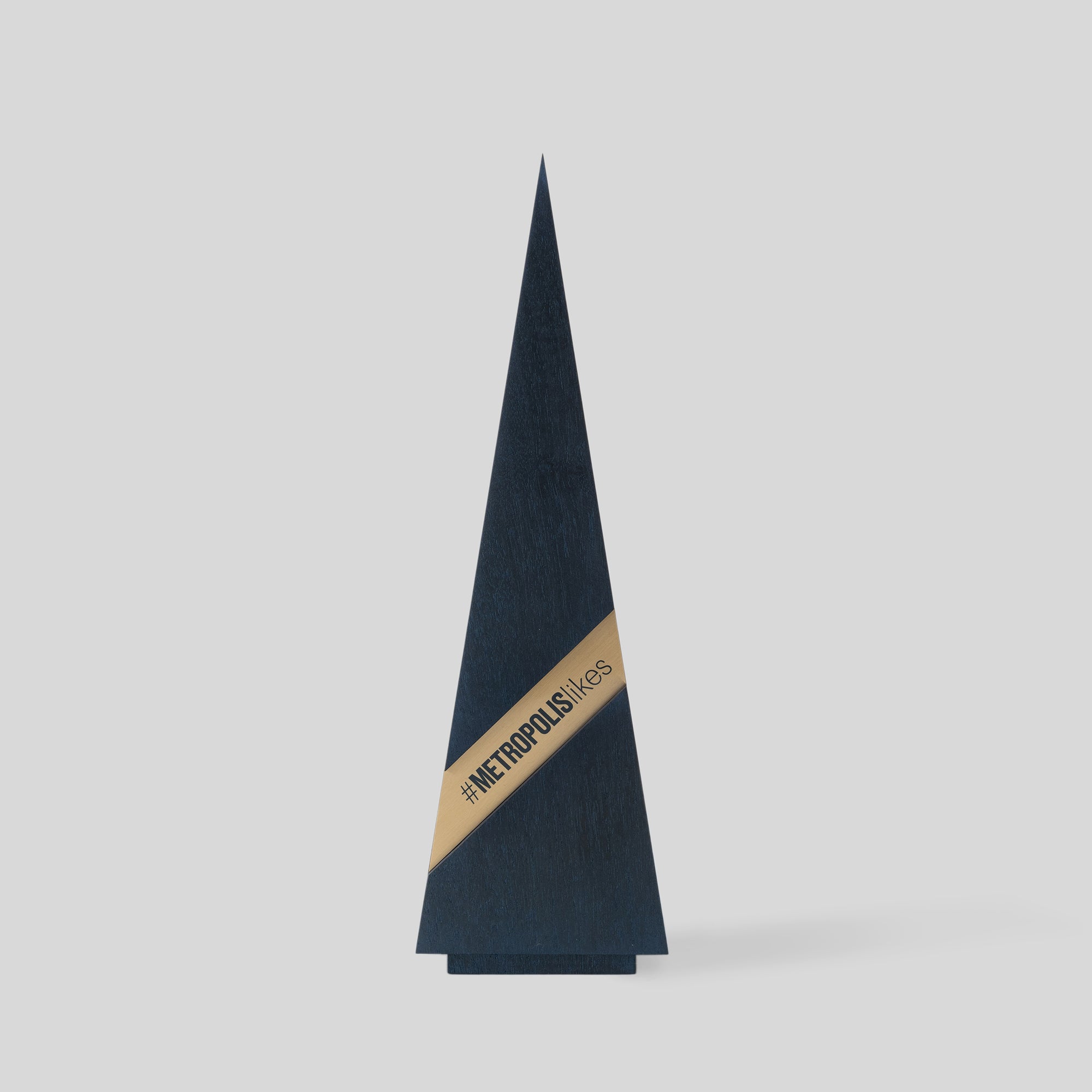 Gracilia Ribbon Award, a triangular trophy with a metal band, exemplifies luxury and customization for personal and corporate recognition, wood and metal, architect-designed and artisan-crafted in the USA.