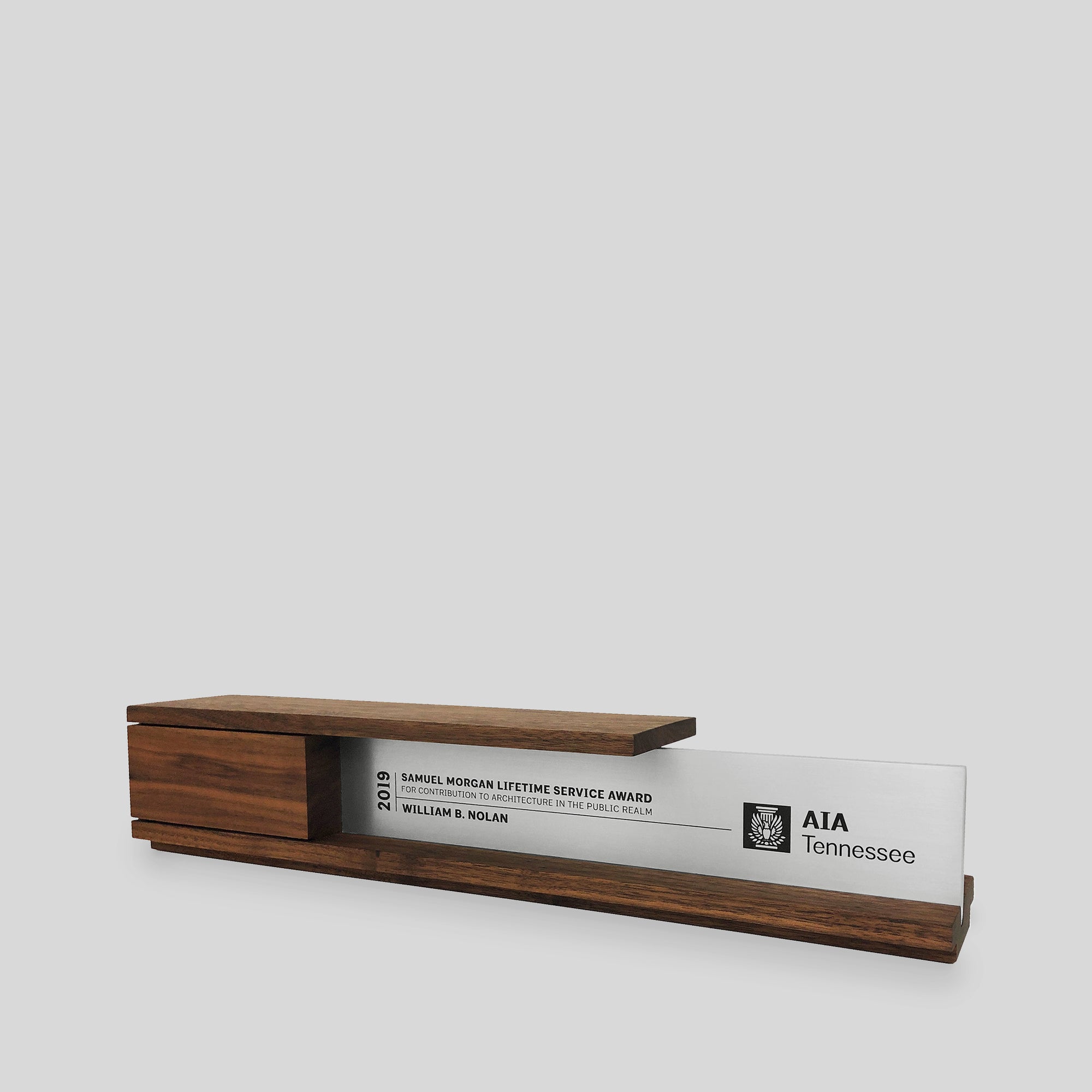 Portico Award, wood and metal trophy, architect-designed and artisan-crafted in the USA., embodies balance and sophistication, ideal for recognizing executives, top sales performers, designers. 