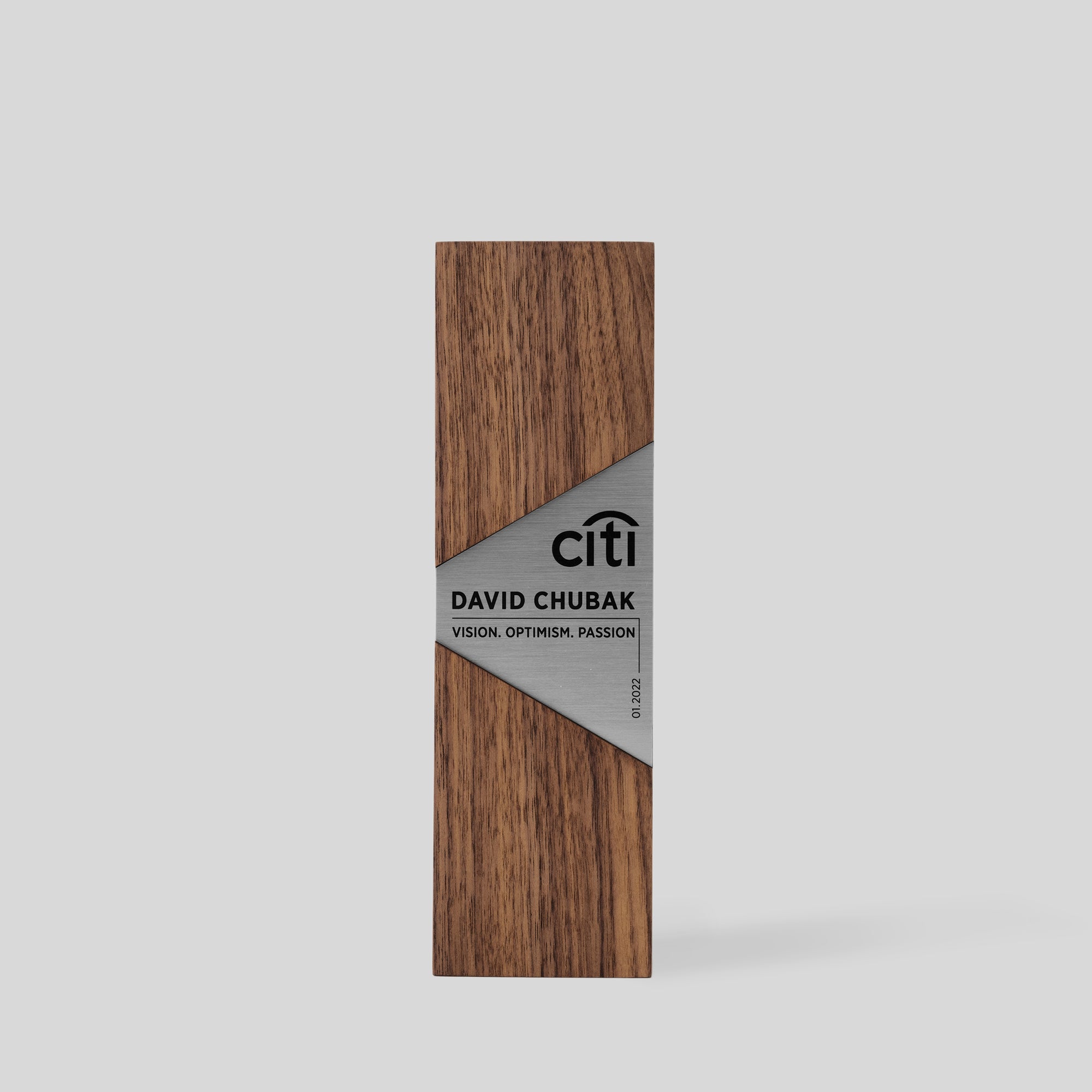 Modern recognition award crafted from wood and metal with custom engraving and personalized for an employee. 